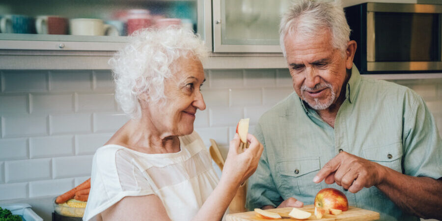 Older couple celebrating Rosh Hashanah at home.