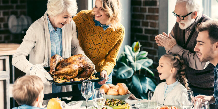 A family celebrating Thanksgiving with a dinner