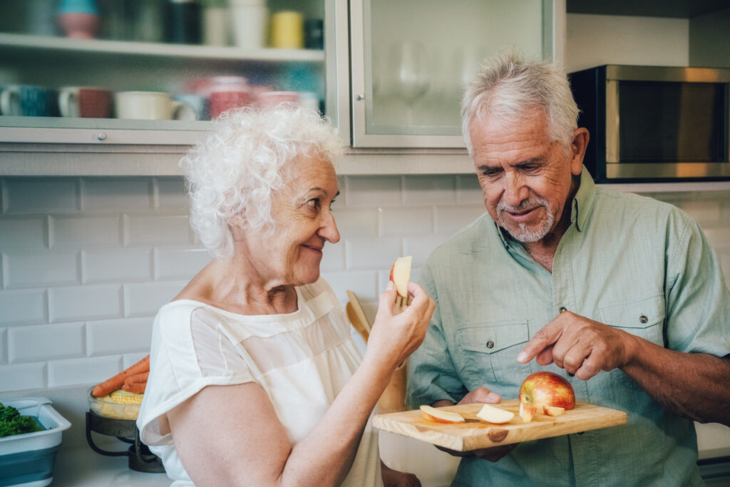 Older couple celebrating Rosh Hashanah at home.