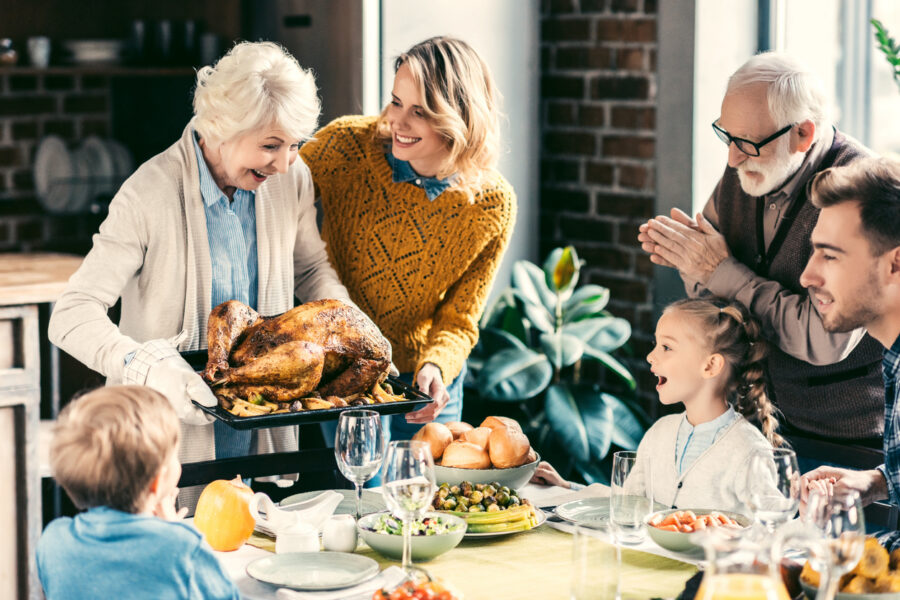 A family celebrating Thanksgiving with a dinner
